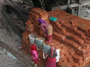 Women handling Bricks at Kopan Monastery