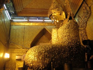 Golden fuzzy Buddha at Mahamuni Paya in Mandalay, Myanmar