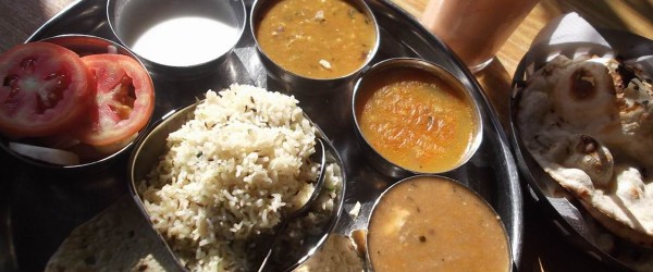 Vegetarian Thali of North India with Daal, Veg Curries, Rice, Roti and Curd