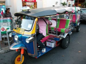 Typical Tuk Tuk with Driver on the Streets of Bangkok, Thailand